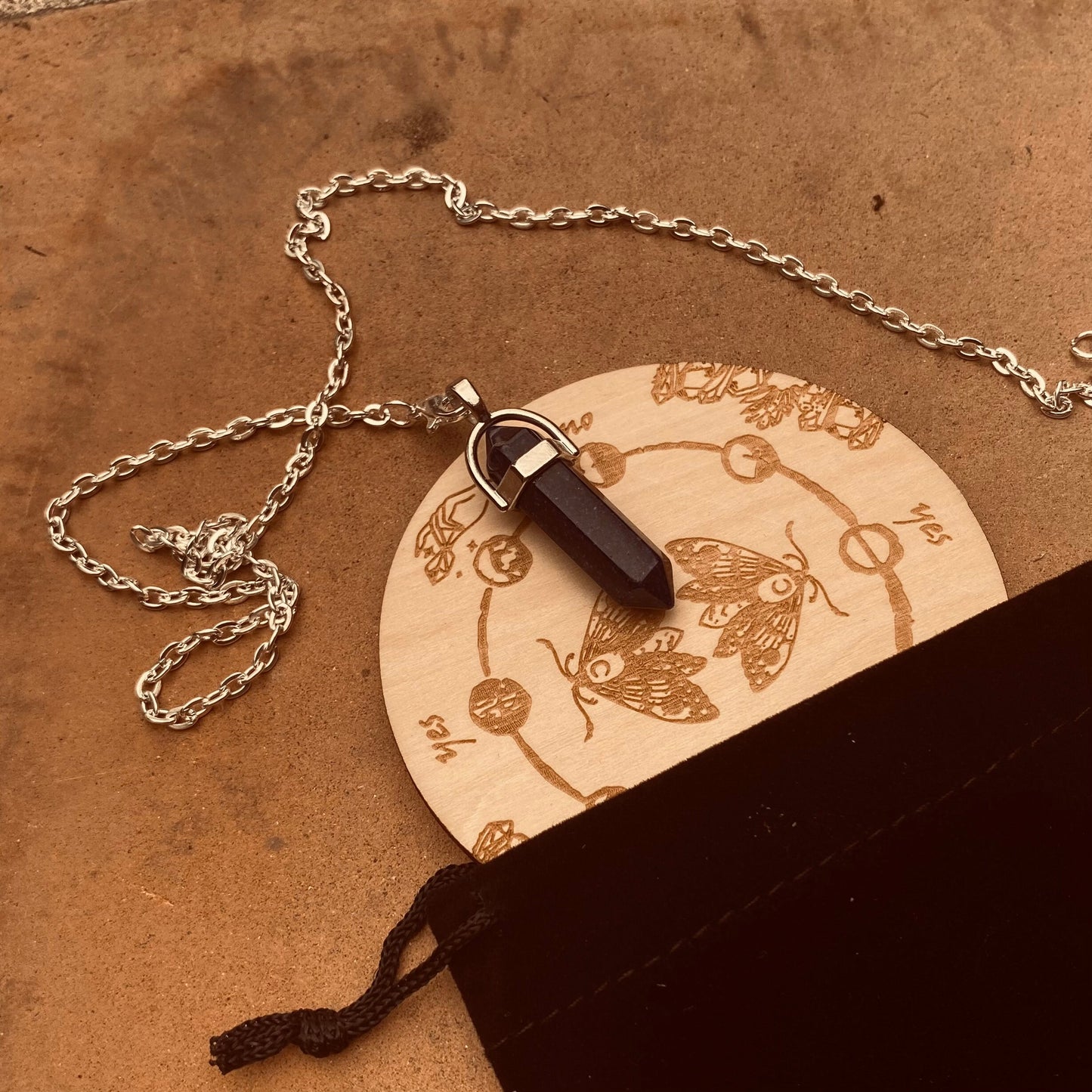 engraved wooden pendulum board